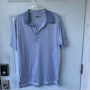 FILA. Men’s Blue short sleeve shirt. Size M. 100% Cotton. Logo on Sleeve.
